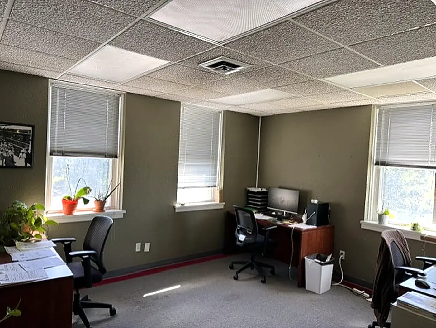 Desks and workstations inside the Emerald Property Management office