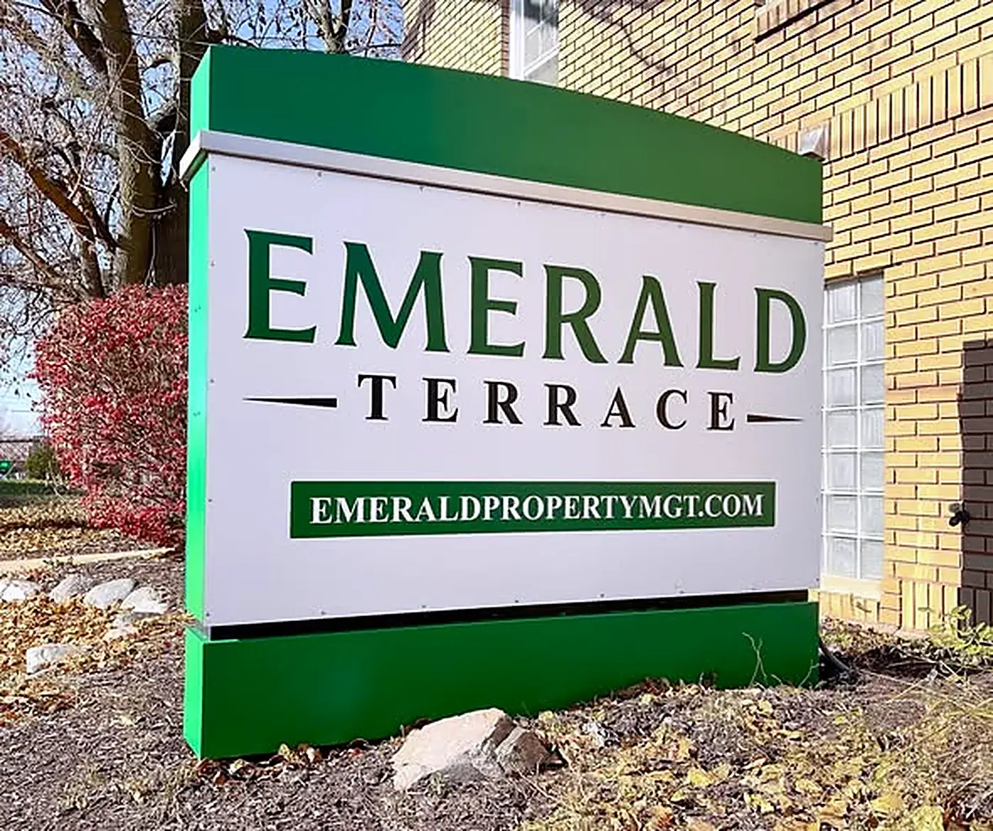 Emerald Terrace sign outside an apartment building managed by Emerald Property Management