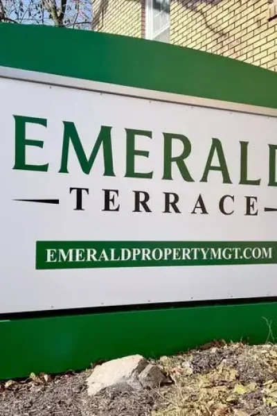Emerald Terrace sign outside an apartment building managed by Emerald Property Management
